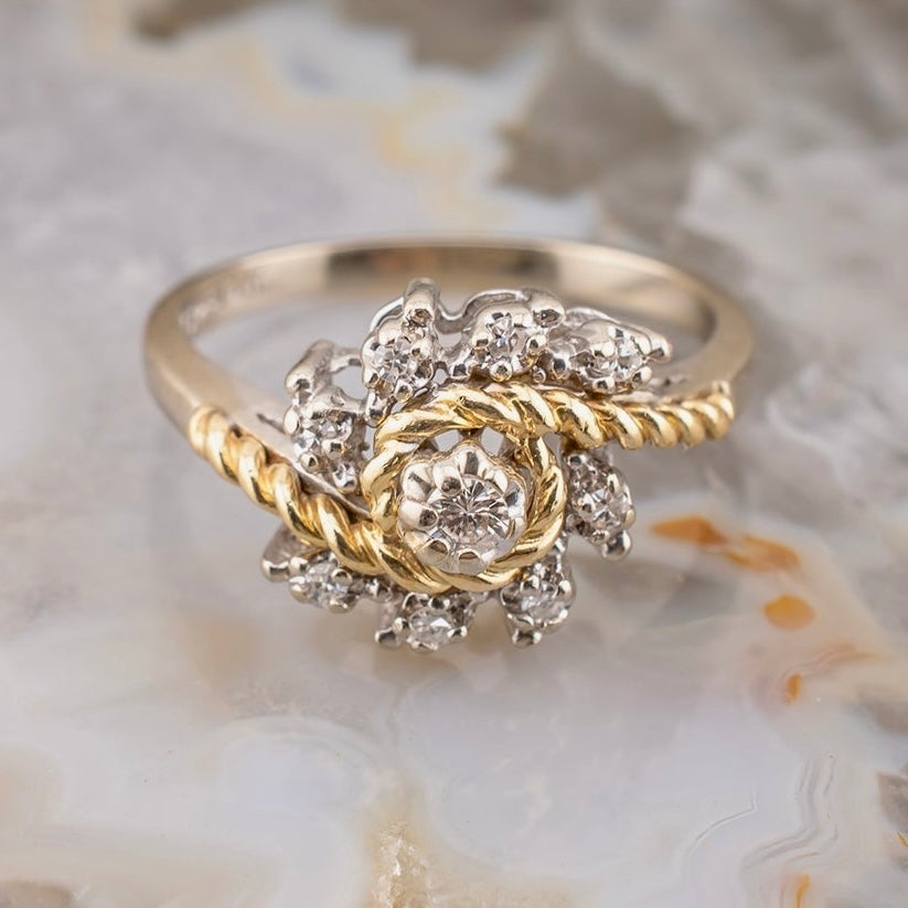 Vintage 14 Karat Two Tone White and Yellow Gold 0.12 Carat Diamond Swirl Design Ring With Rope Detail Size 5.75 Circa 1980s