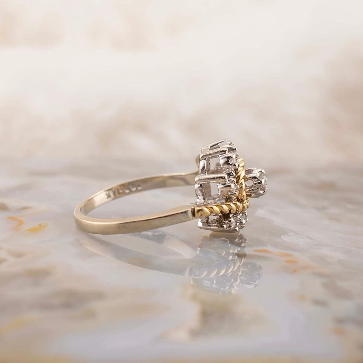 Vintage 14 Karat Two Tone White and Yellow Gold 0.12 Carat Diamond Swirl Design Ring With Rope Detail Size 5.75 Circa 1980s