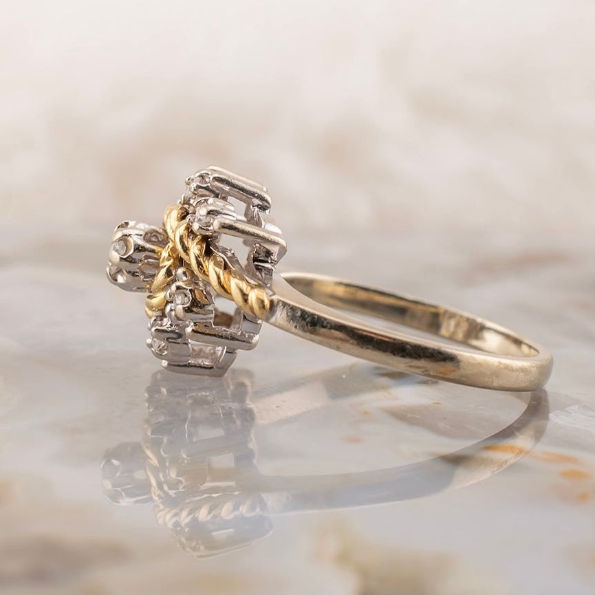 Vintage 14 Karat Two Tone White and Yellow Gold 0.12 Carat Diamond Swirl Design Ring With Rope Detail Size 5.75 Circa 1980s