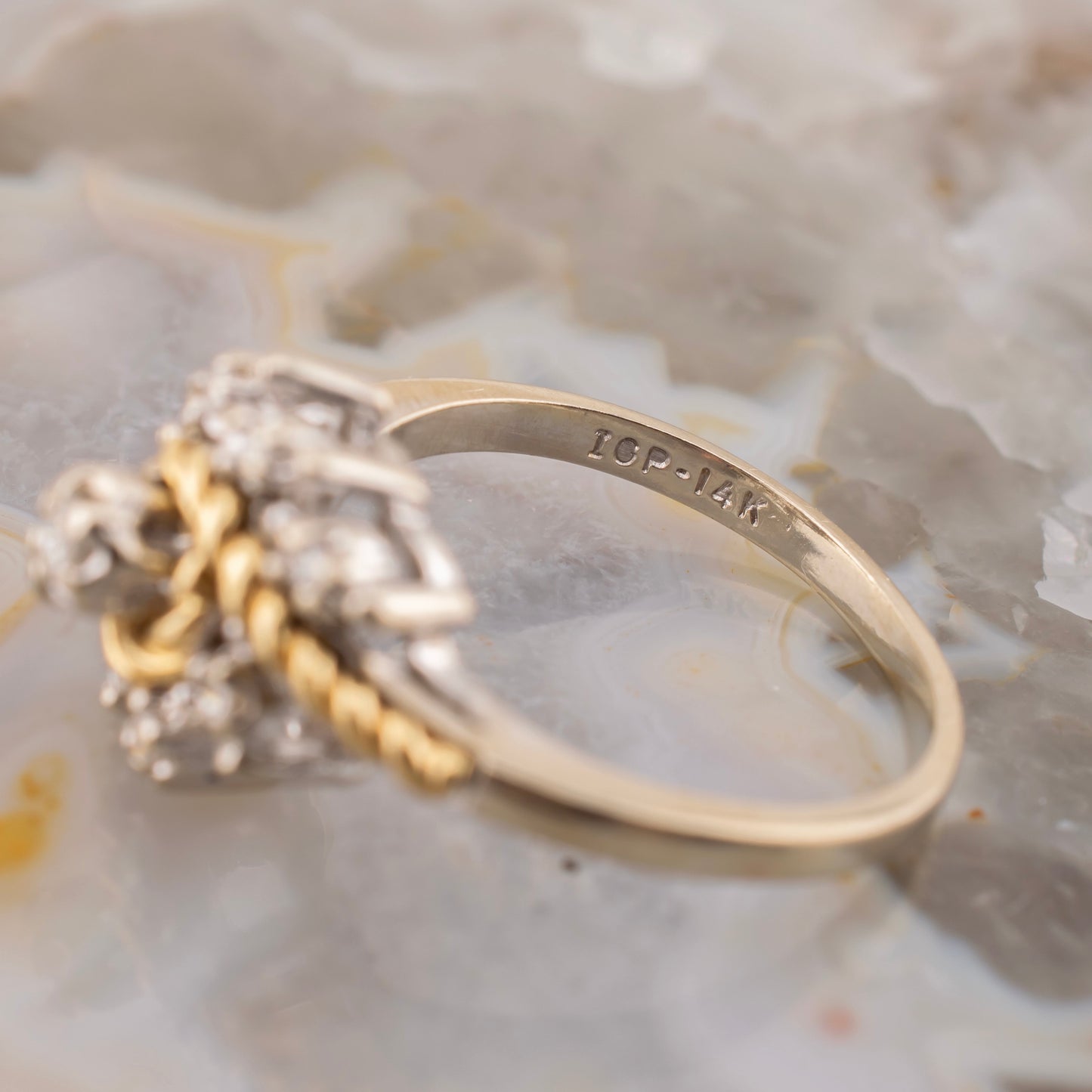 Vintage 14 Karat Two Tone White and Yellow Gold 0.12 Carat Diamond Swirl Design Ring With Rope Detail Size 5.75 Circa 1980s
