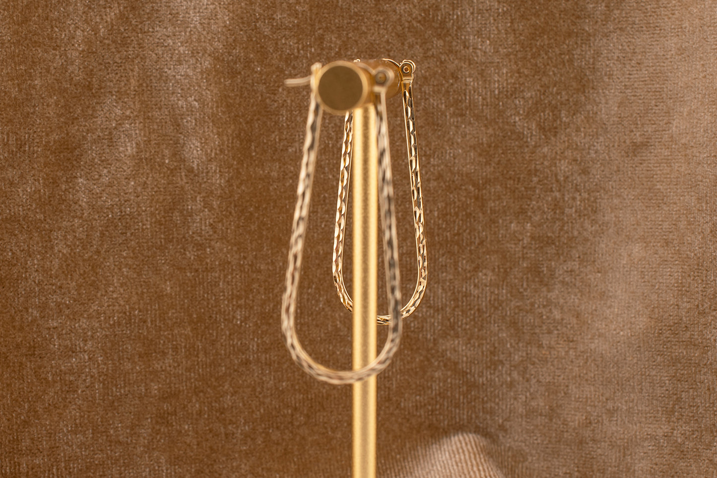 Circa 1990s Vintage 10 Karat Yellow Gold Elongated Diamond Cut Hoop Earrings