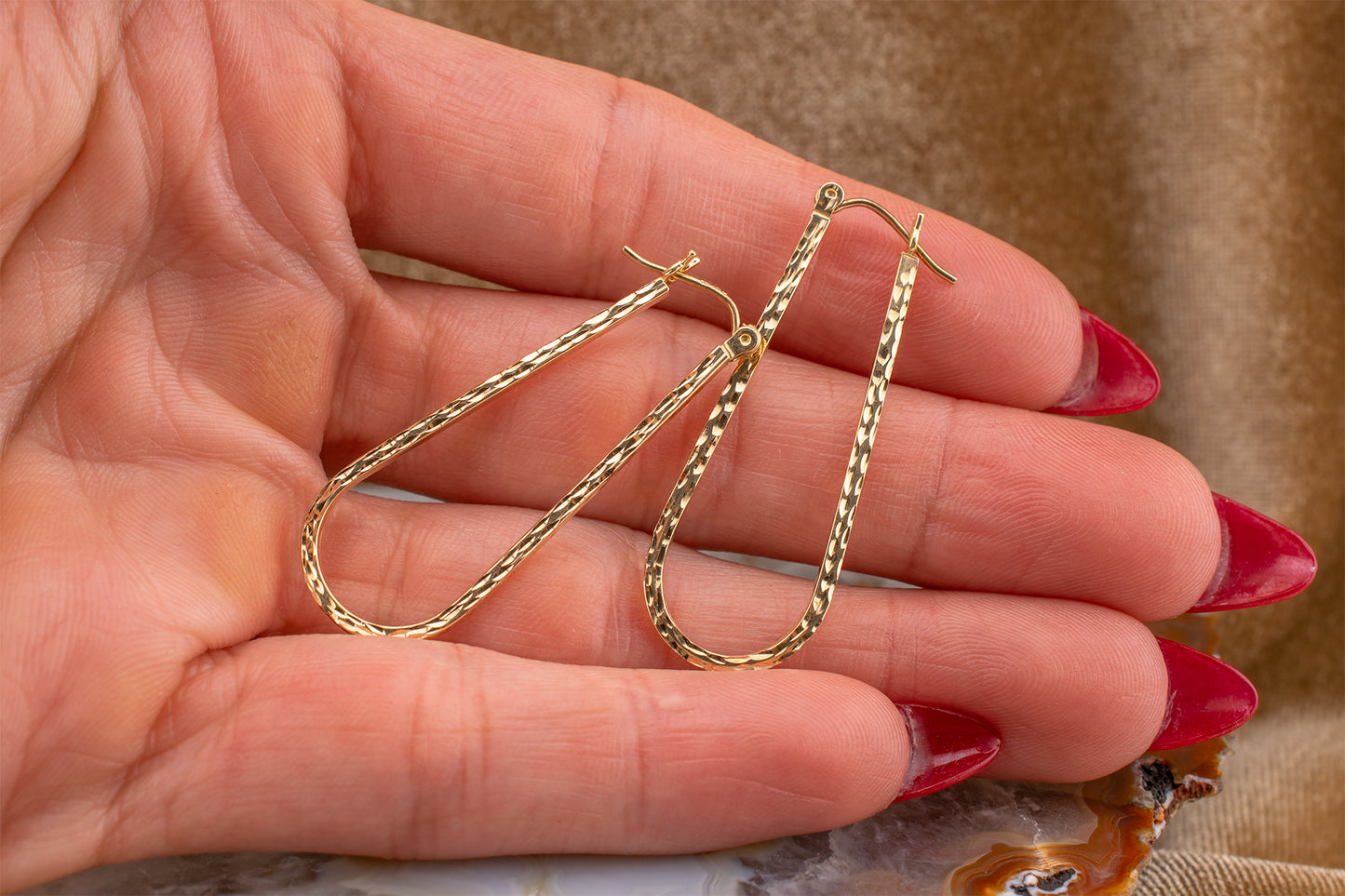 Circa 1990s Vintage 10 Karat Yellow Gold Elongated Diamond Cut Hoop Earrings