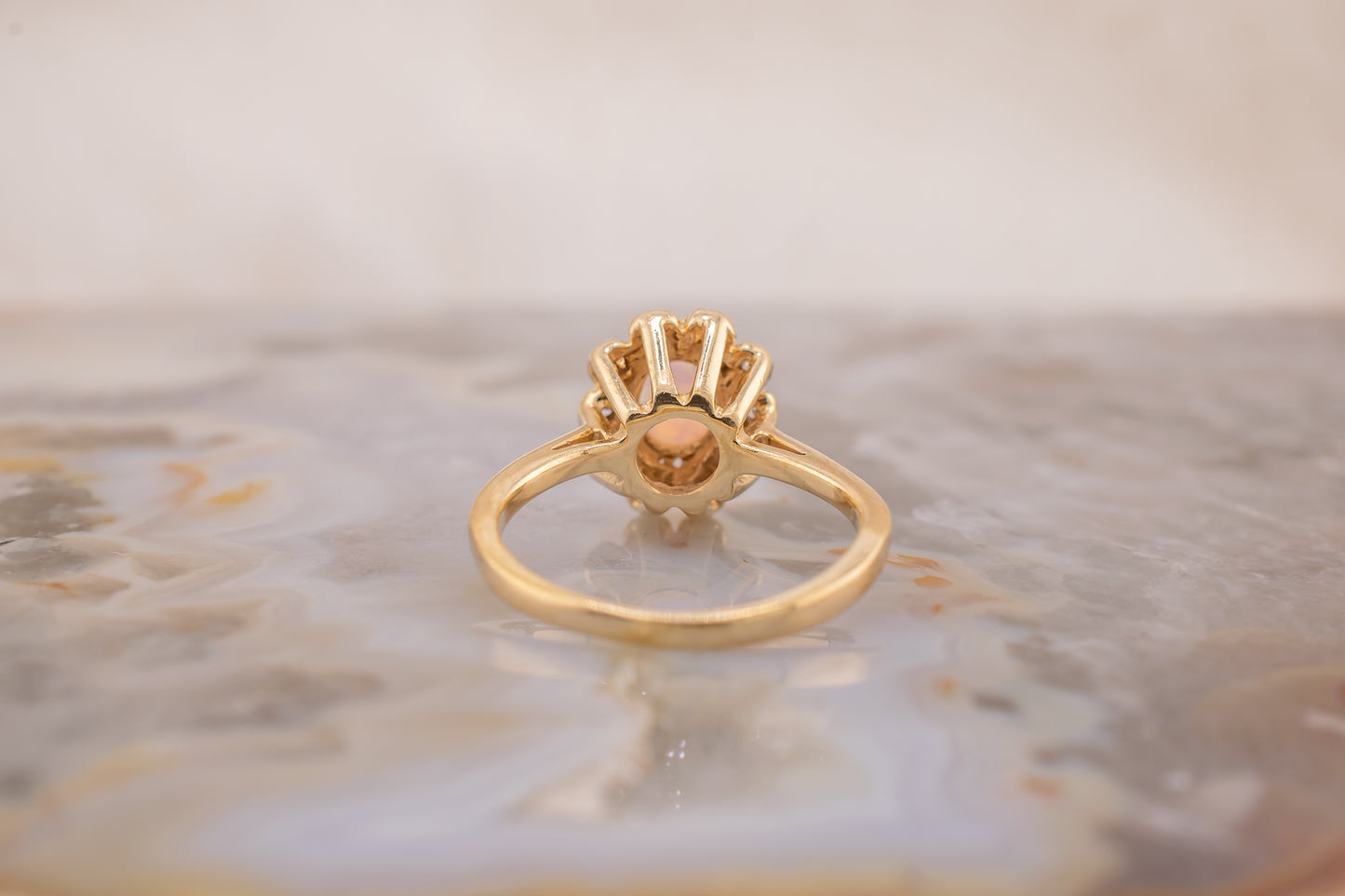 Circa 1940s Retro Era Vintage 14 Karat Yellow Gold 0.05 Carat Diamond Halo and 0.28 Carat Oval Cabochon Small Ring, Pinky Ring