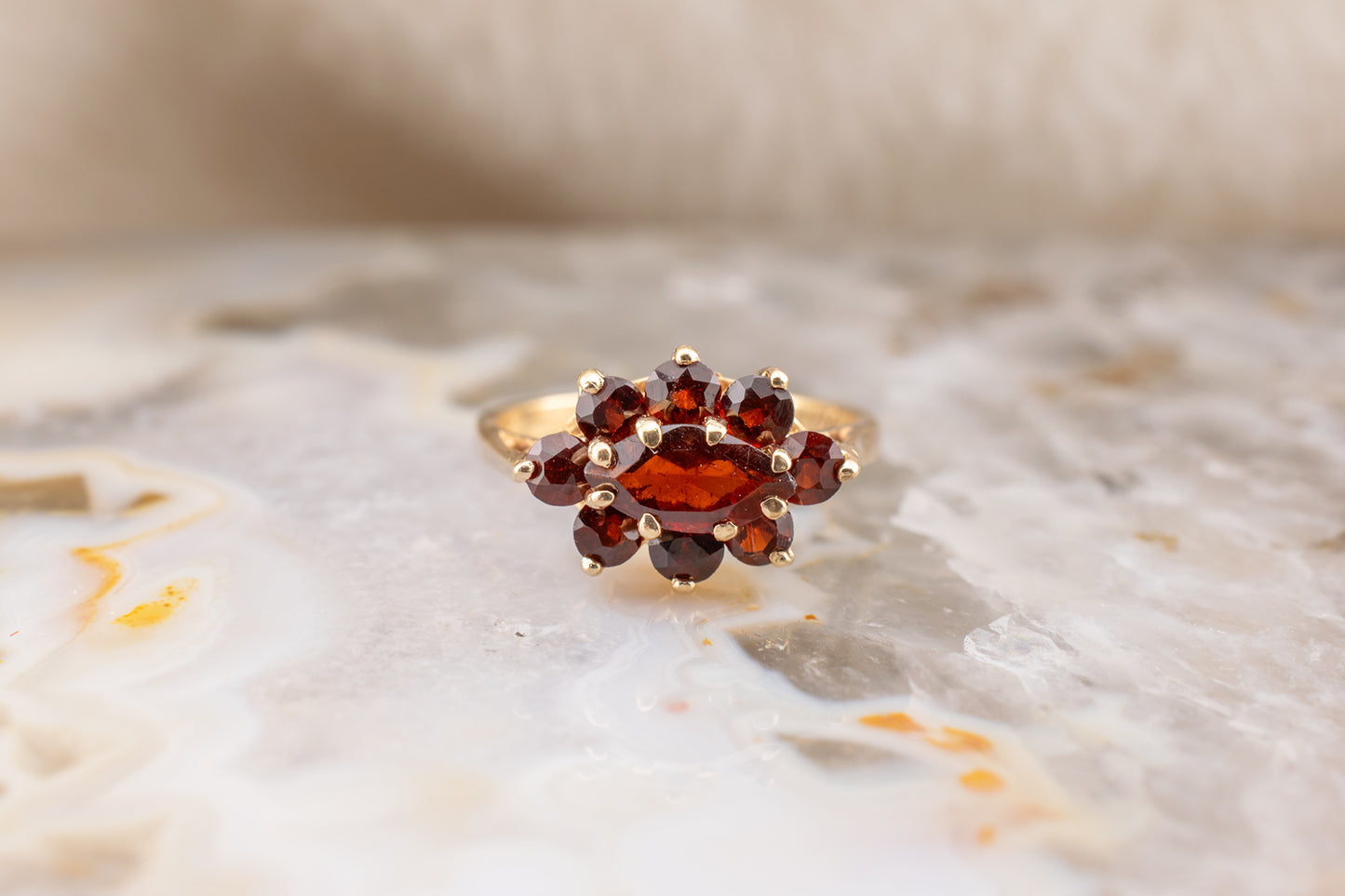 Circa 1990s Vintage 10 Karat Yellow Gold Marquise and Round Shape 1.21 Carat Garnet Small Ring Size 3.75