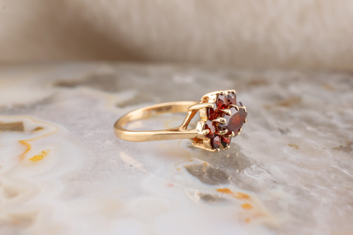 Circa 1990s Vintage 10 Karat Yellow Gold Marquise and Round Shape 1.21 Carat Garnet Small Ring Size 3.75