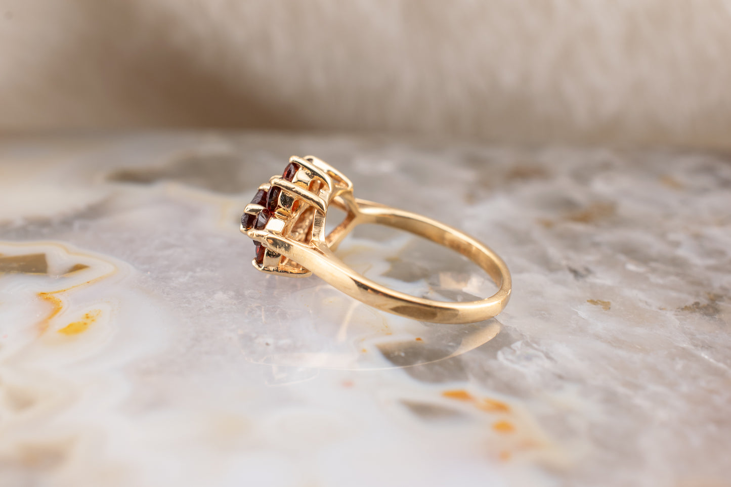 Circa 1990s Vintage 10 Karat Yellow Gold Marquise and Round Shape 1.21 Carat Garnet Small Ring Size 3.75