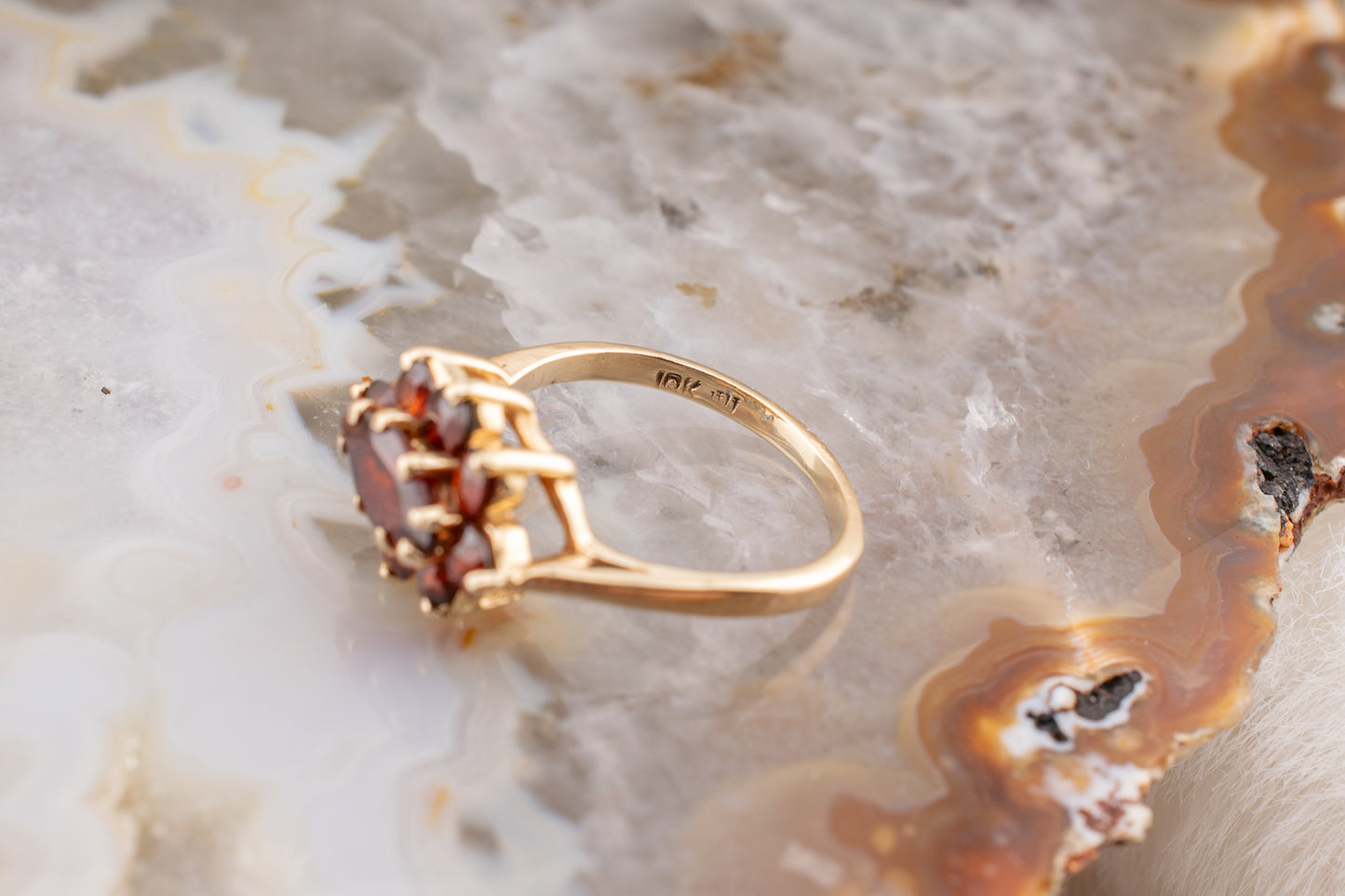 Circa 1990s Vintage 10 Karat Yellow Gold Marquise and Round Shape 1.21 Carat Garnet Small Ring Size 3.75