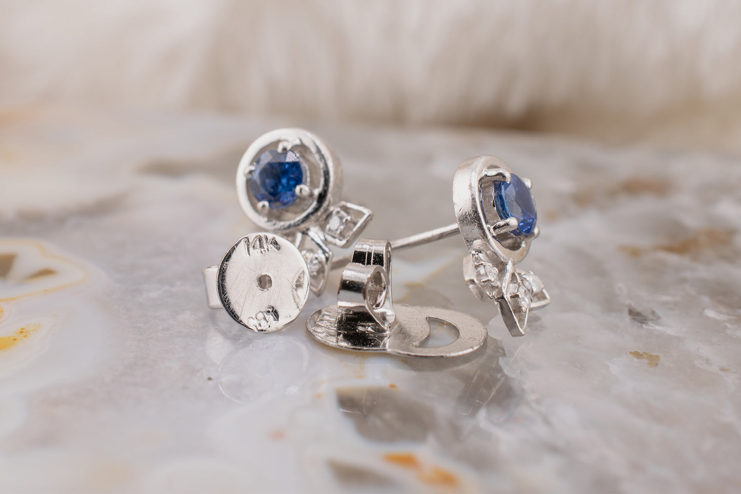 Minimalist Circa 2000s Vintage Estate 14 Karat White Gold 0.50 Carat Round Blue Sapphire and 0.06 Carat Diamond Push Back Stud Earrings