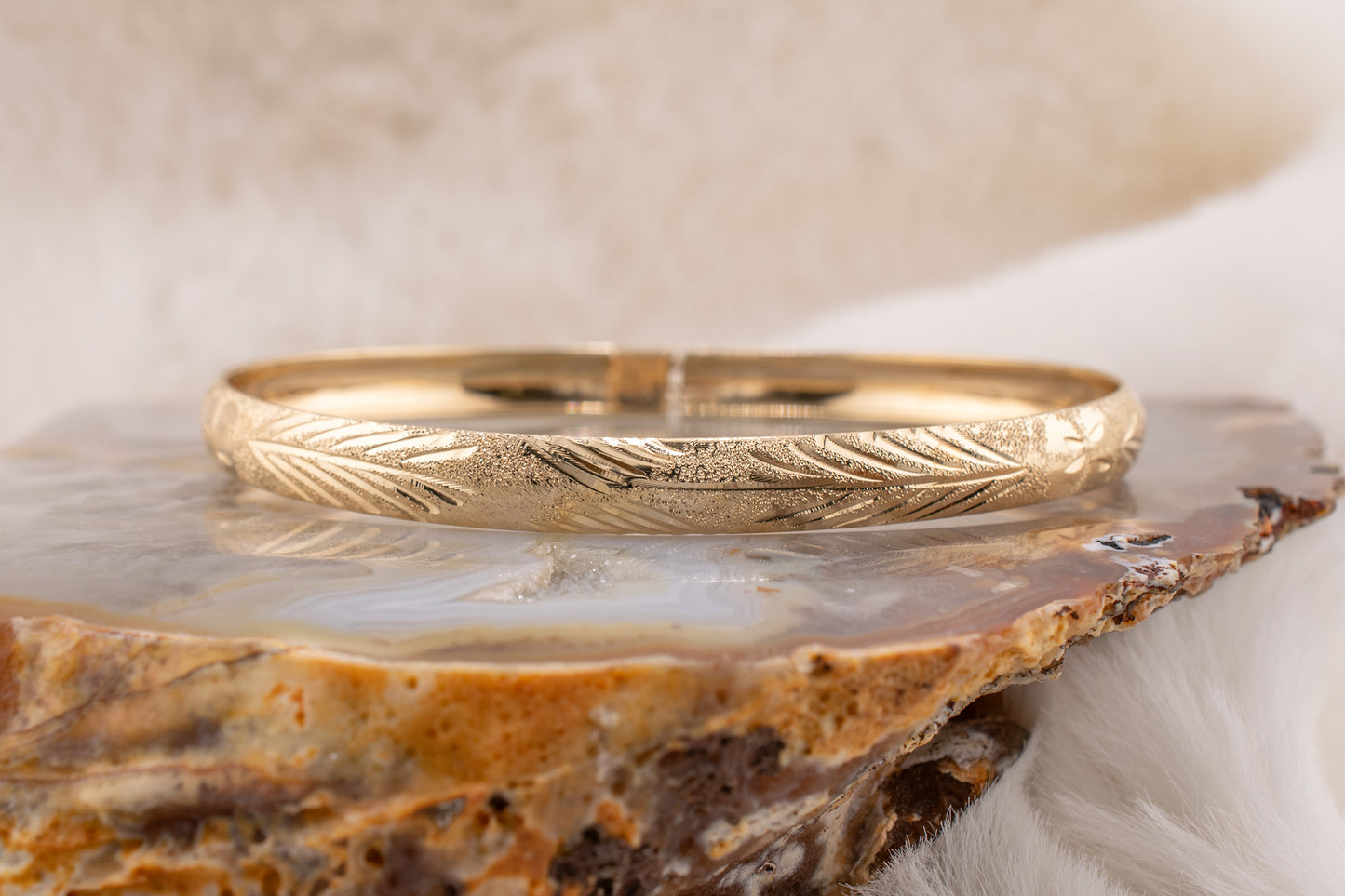 Circa 2000-2005 Vintage 10 Karat Yellow Gold Palm Leaf Design and Diamond Cut Detail Bangle Bracelet Approx. 7.75 Inches 6.2mm Wide