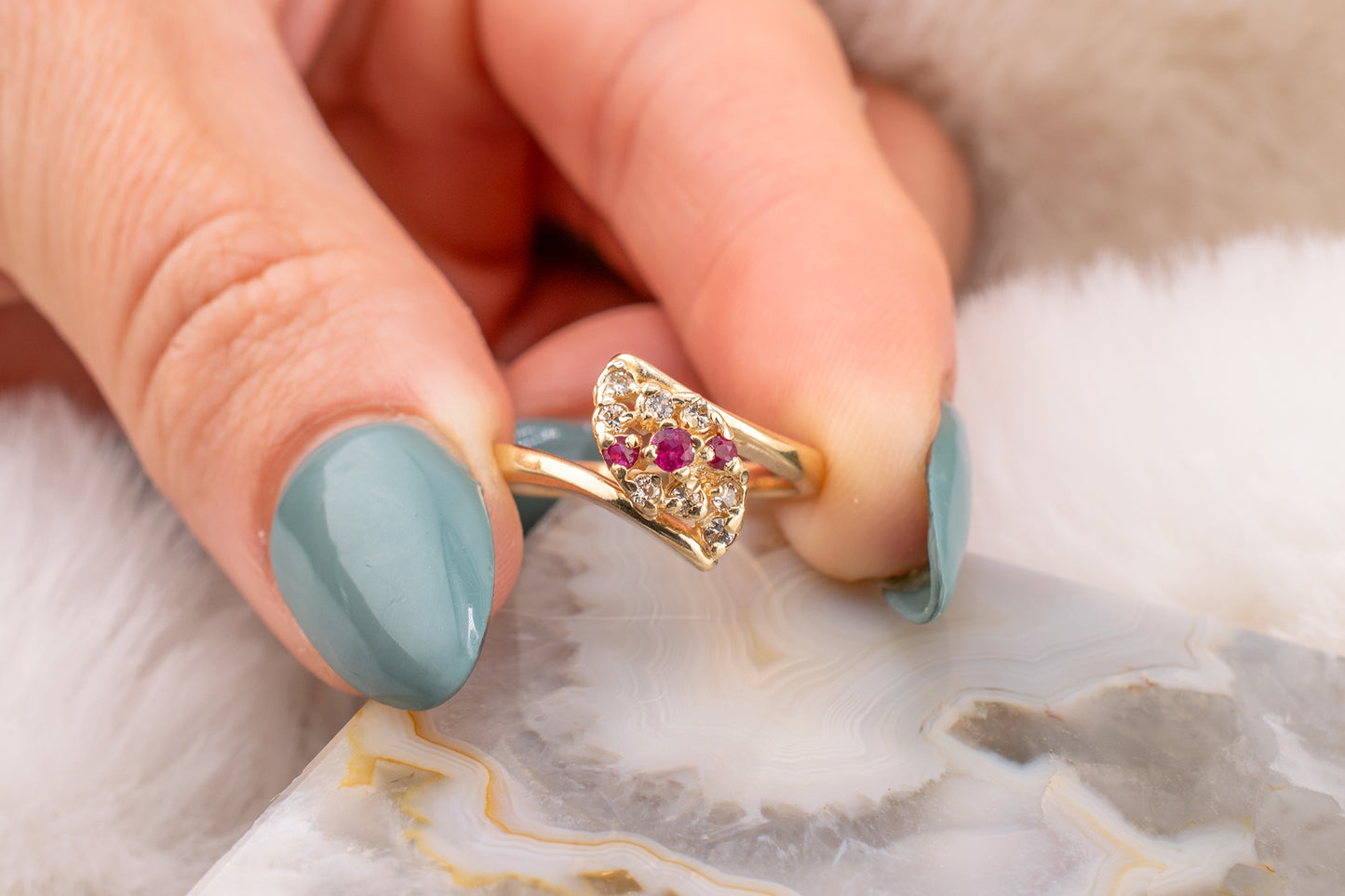 Circa 1980s Vintage 14 Karat Yellow Gold 0.08 Carat Diamond and 0.10 Carat Natural Ruby Navette Shaped Design Ring Size 4 3/4