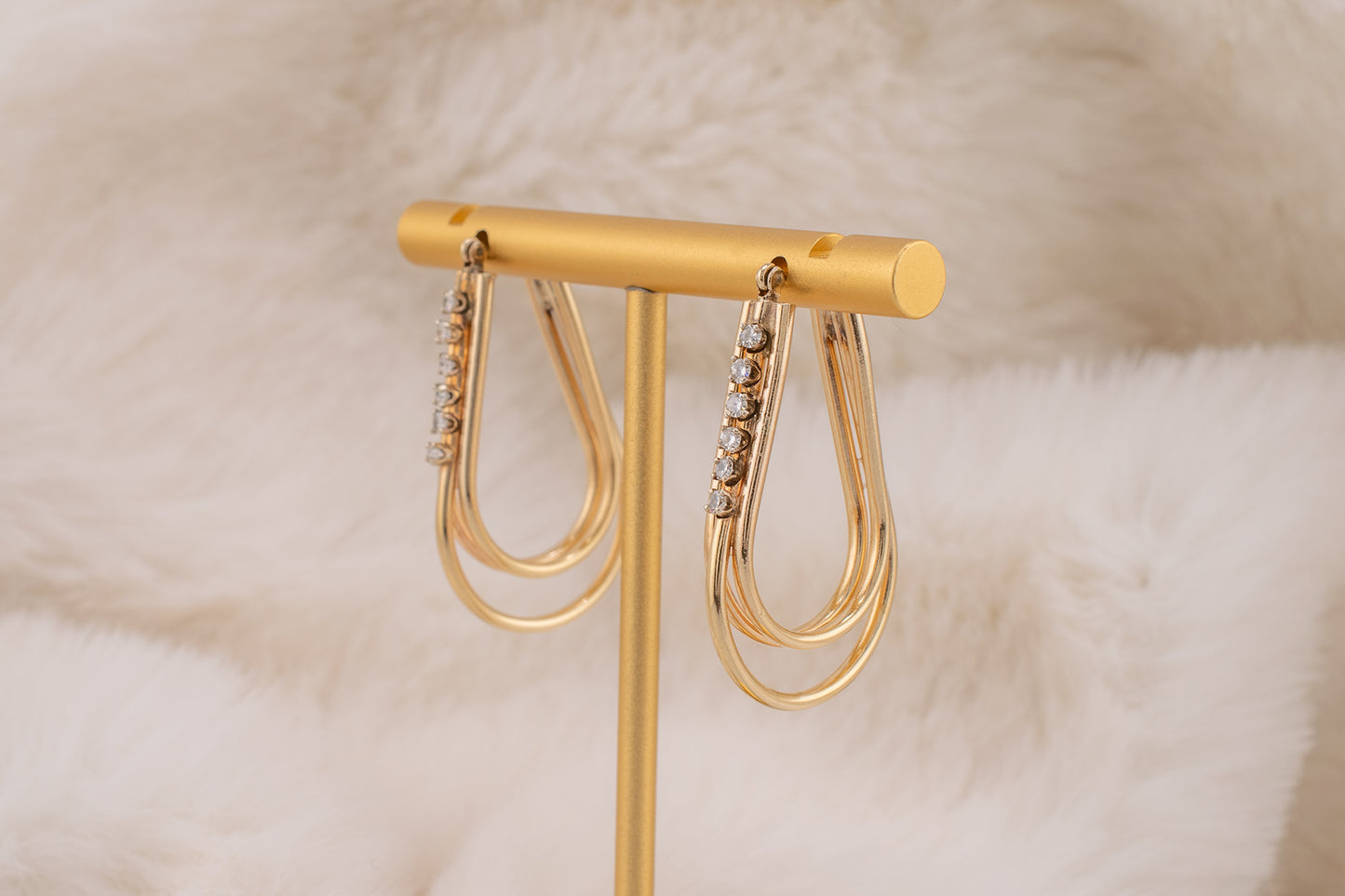 Circa 1980s Vintage 14 Karat Yellow Gold Prong Set 0.24 Carat Total Weight Natural Diamond Elongated Hoop Earrings 1.3 Inch Drop