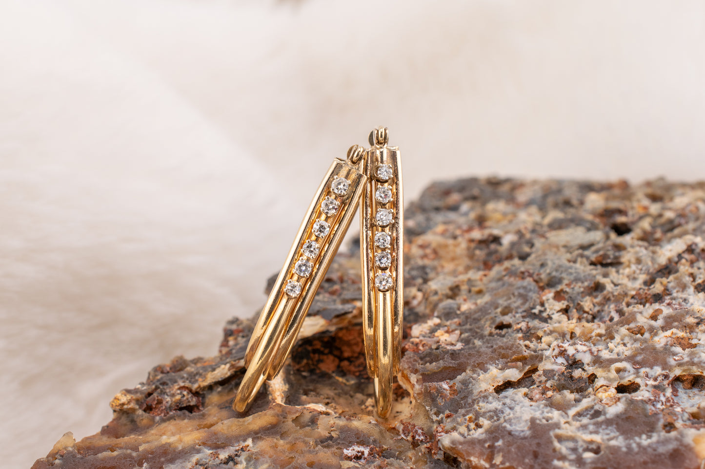 Circa 1980s Vintage 14 Karat Yellow Gold Prong Set 0.24 Carat Total Weight Natural Diamond Elongated Hoop Earrings 1.3 Inch Drop