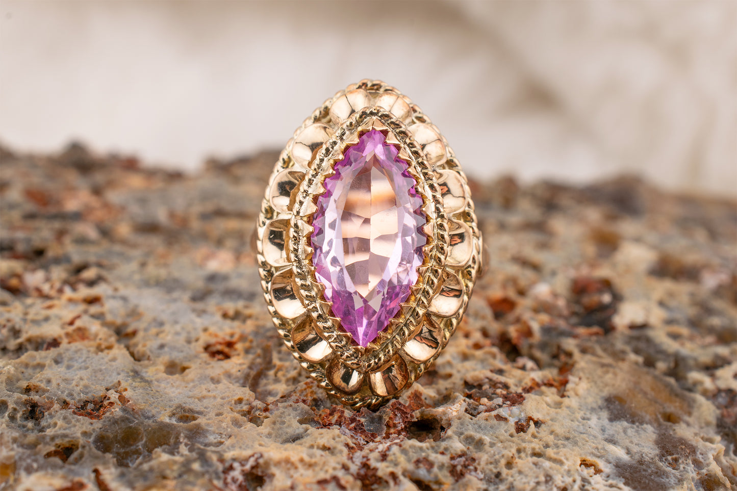 Circa 1950s-1960s Vintage 10 Karat Yellow Gold 3.73 Carat Marquise Shape Lab Grown Pink Sapphire Scalloped Cocktail Ring