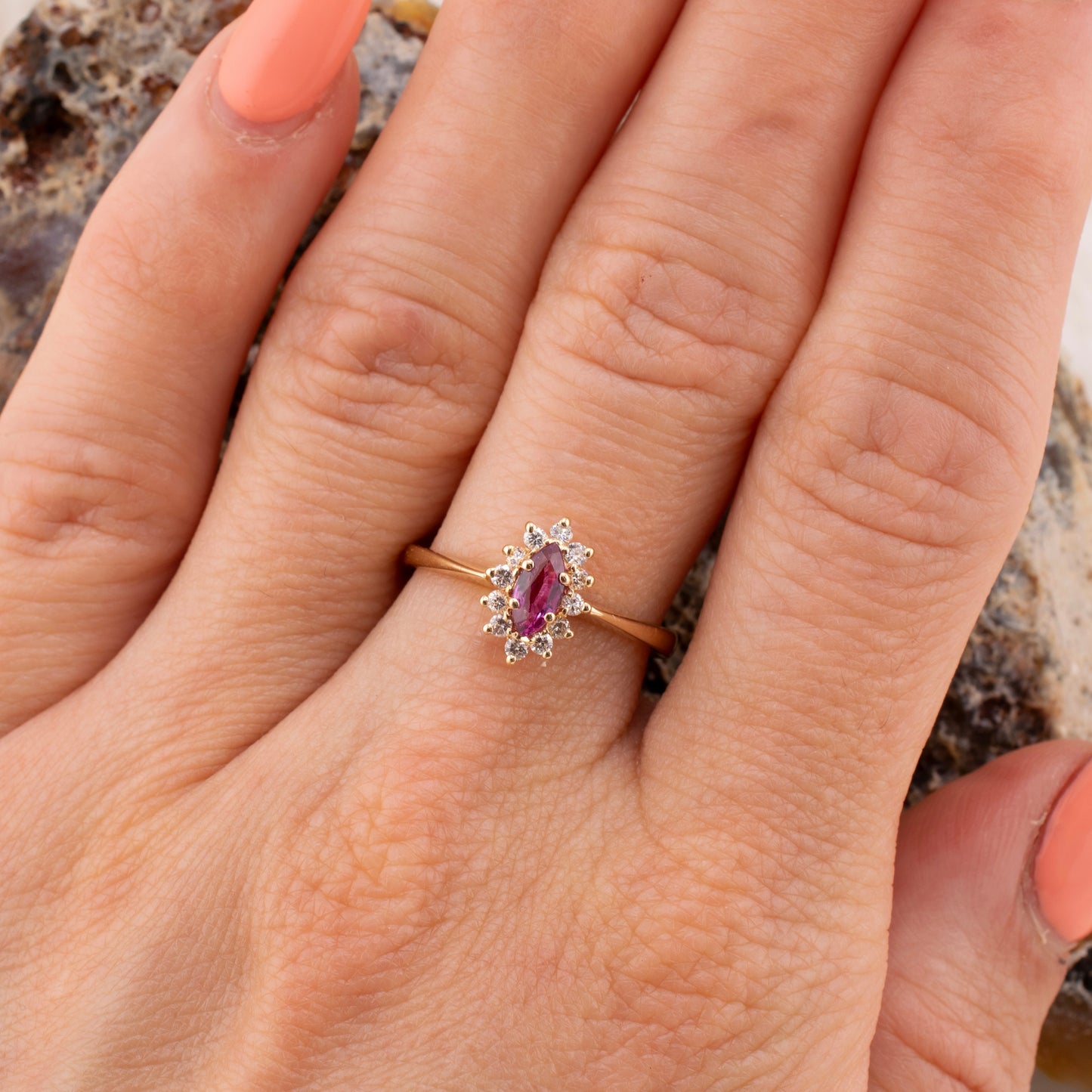 Vintage 14 Karat Yellow Gold 0.26 Carat Marquise Shape Pink Sapphire and 0.11 ctw. Diamond Halo Ring