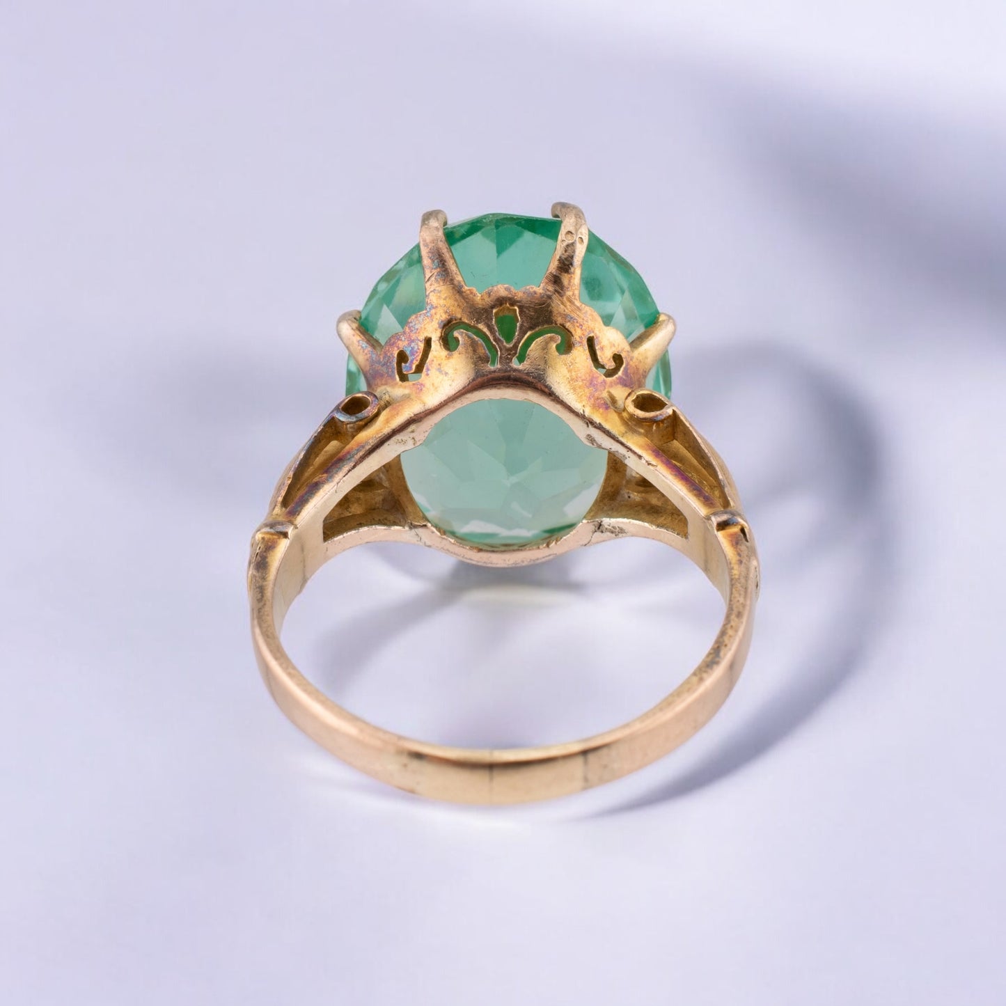 Circa 1940s Vintage 10 Karat Yellow Gold 18.58 Carat Uranium Green Synthetic Spinel Cocktail Ring