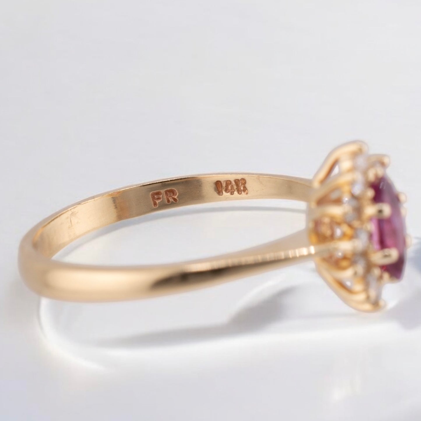 Vintage 14 Karat Yellow Gold 0.26 Carat Marquise Shape Pink Sapphire and 0.11 ctw. Diamond Halo Ring