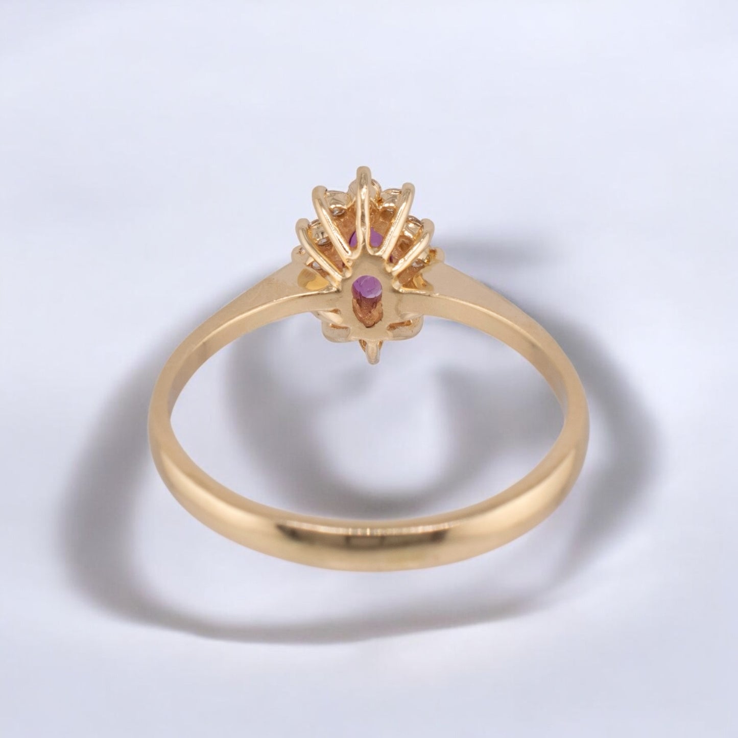 Vintage 14 Karat Yellow Gold 0.26 Carat Marquise Shape Pink Sapphire and 0.11 ctw. Diamond Halo Ring