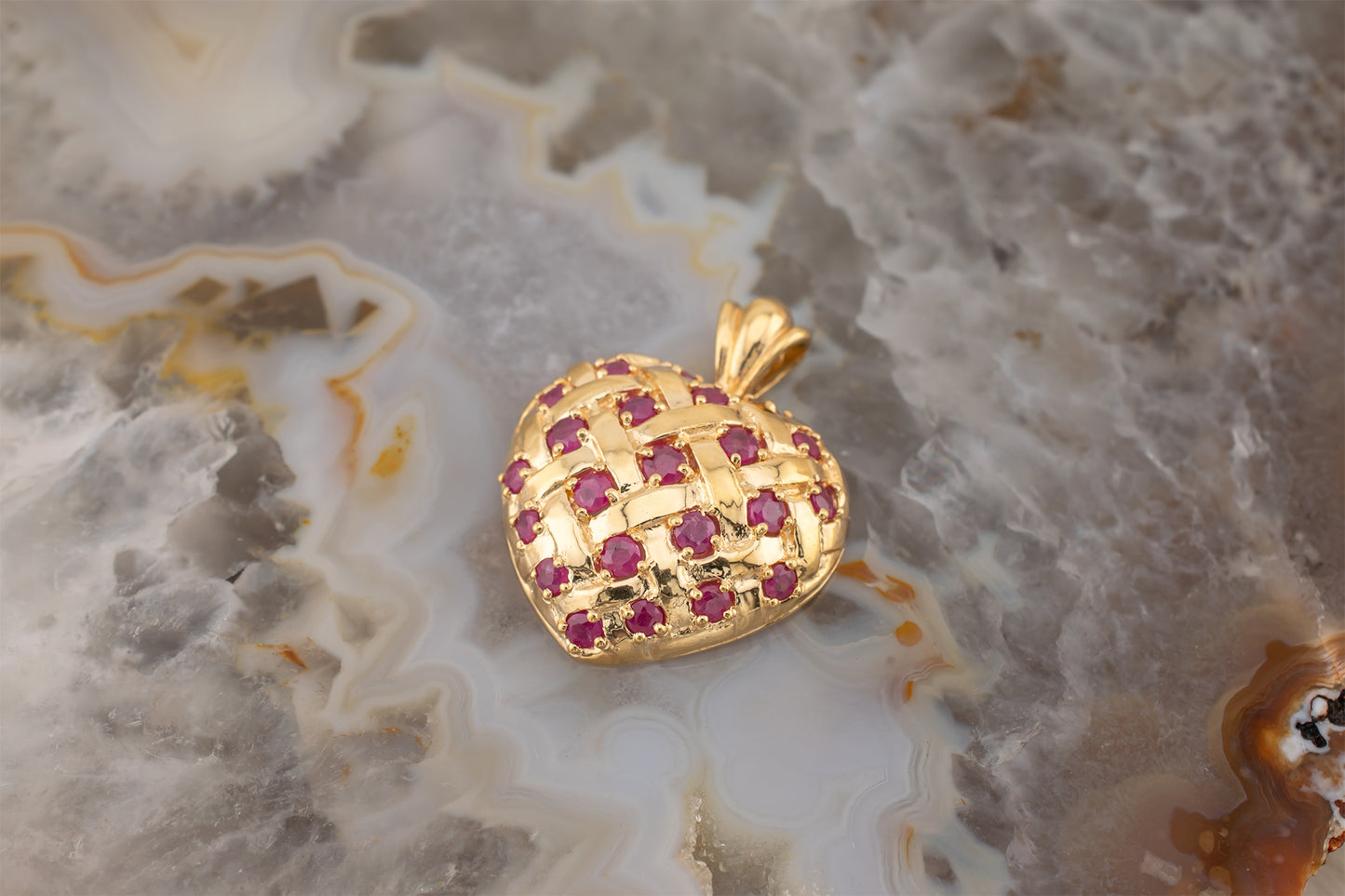 Circa 1990s Vintage 10 Karat Yellow Gold Lattice Design Quilted Heart Pendant Charm With Natural Rubies