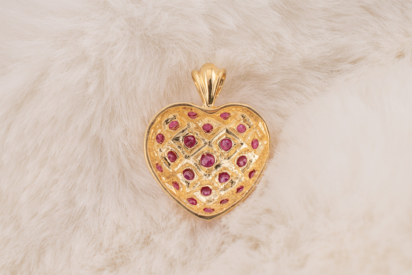 Circa 1990s Vintage 10 Karat Yellow Gold Lattice Design Quilted Heart Pendant Charm With Natural Rubies