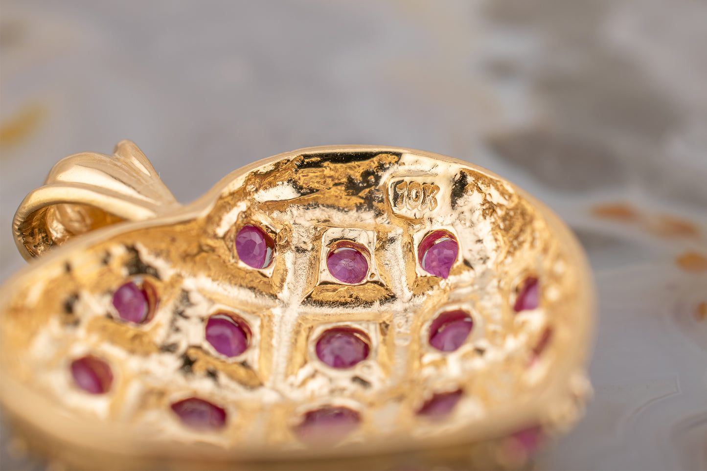 Circa 1990s Vintage 10 Karat Yellow Gold Lattice Design Quilted Heart Pendant Charm With Natural Rubies