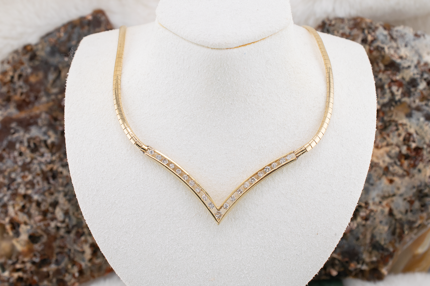 Circa 1980s Vintage 14 Karat Yellow Gold V-shape Channel Set Natural Diamond Necklace 0.97 Carats, Omega Chain, 17 Inches