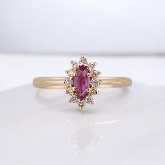 Vintage 14 Karat Yellow Gold 0.26 Carat Marquise Shape Pink Sapphire and 0.11 ctw. Diamond Halo Ring